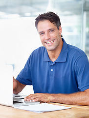 Image showing Portrait, happy man and laptop in modern office for startup for profession, career or choice with job. Mature person, entrepreneur and business in digital marketing with technology, computer and web