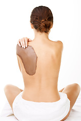 Image showing Mud, treatment and back of woman with skincare, detox or natural cosmetics in white background or studio. Dermatology, care and person with application of dirt, mask or exfoliate skin and body in spa