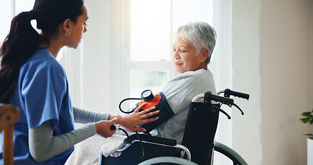 Image showing Woman, nurse and senior in wheelchair for blood pressure, monitoring or elderly care at old age home. Doctor or medical caregiver checking BPM of mature patient or person with a disability at house