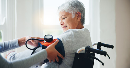 Image showing Woman, doctor and senior in wheelchair for blood pressure, monitoring or elderly care at old age home. Nurse or medical caregiver checking BPM of mature patient or person with a disability at house