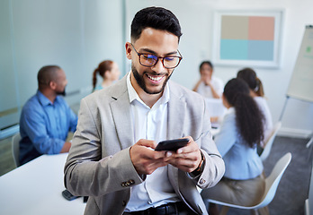 Image showing Business man, phone and texting in office, meeting and happy for notification, deal and networking at company. Accountant, smartphone and smile in boardroom with typing, fintech and thinking at job