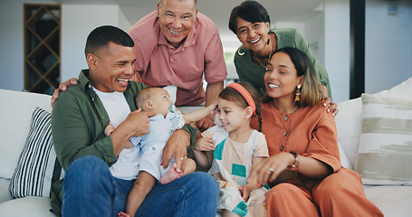 Image showing Happy, smile and big family playing on sofa in the living room at modern home together. Bonding, love and young kids relaxing with parents and grandparents for generations in the lounge at house.