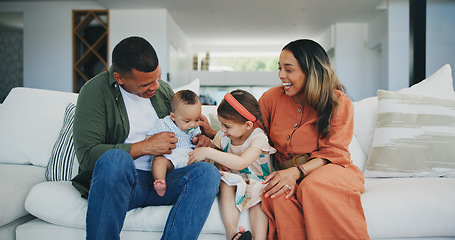 Image showing Family, happiness and play on couch, smile and joy or love, bonding and humor or comedy, sofa and fun. Happy parents and children, laughing and support at home, silly and goofy or tickle a baby