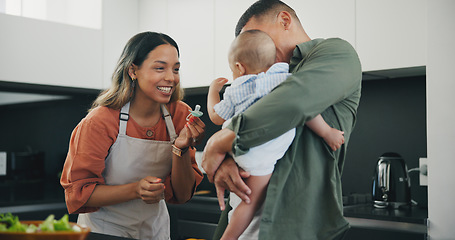 Image showing Family, smile and pacifier in kitchen, love and bonding or fun, relax and support or laughing on diet. Happy parents and baby, connect and humor or cooking, nutrition and healthy food or meal at home