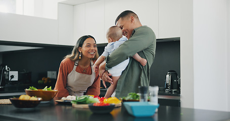 Image showing Family, smile and play in kitchen, love and bonding or fun, relax and support or laughing at home. Happy parents and baby, connect and humor or cooking, nutrition and healthy food or care for child