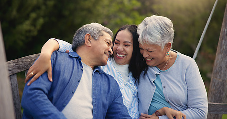 Image showing Happy family, senior parents or woman on bench in nature, hug or bonding in smile on retirement. Mature man, mother and older daughter for together in laughter, lounge and embrace for love in garden