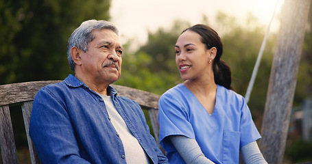 Image showing Retirement, old man and nurse on a bench in the park together for nostalgia or thinking of a memory. Summer, healthcare and a woman caregiver in a garden with a senior patient for conversation