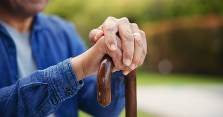 Image showing Senior, person or hands with closeup of walking stick for mobility support, balance or alzheimer in park. Elderly, man or cane outdoor in nature for healthcare, arthritis or rehabilitation for health