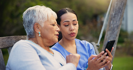 Image showing Outdoor, bench and nurse with old woman, smartphone and connection with social media, conversation and internet. Pensioner, outdoor and caregiver with elderly person, cellphone and typing with email