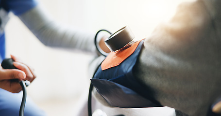 Image showing Person, doctor and checking patient blood pressure for monitoring, healthcare or results at home. Closeup of medical nurse or caregiver with machine to check BPM, heart rate or examination at house