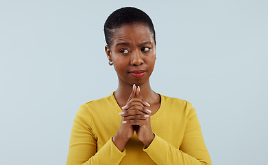 Image showing Doubt, wish and thinking, black woman in studio with hope for opportunity, deal or good news prayer. Hands together, emoji and person with ideas, offer and faith on white background with confusion.
