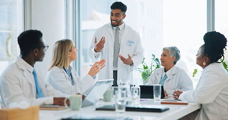 Image showing Man, doctor and team in meeting for healthcare, planning or strategy together at hospital or office. Group of medical employees in teamwork, discussion or collaboration for presentation at clinic