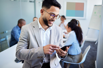 Image showing Business man, phone and texting in meeting room, happy or email notification for deal, networking and company. Accountant, smartphone and smile in boardroom with typing, fintech or thinking at office