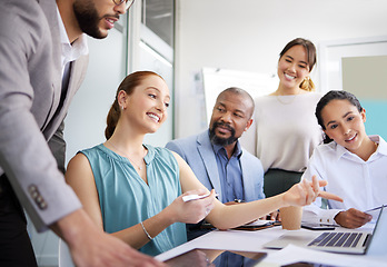 Image showing Business people, mentor and laptop in office for coaching, collaboration or planning marketing strategy. Teamwork, men and women employees in discussion or communication with technology for project