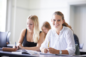 Image showing College student, portrait and learning with notes in class, lecture or people in education. University, classroom and face of happy woman with notebook, knowledge and studying in academy or school