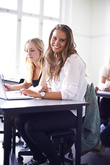 Image showing Portrait, college student and learning with laptop in class, lecture or people in education. University, classroom and face of happy woman with notes, knowledge and studying in academy or school