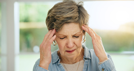 Image showing Stress, headache or old woman in home with burnout, worry or fatigue in retirement frustrated by debt. Exhausted person, anxiety or tired elderly lady with problem, crisis or head pain with migraine