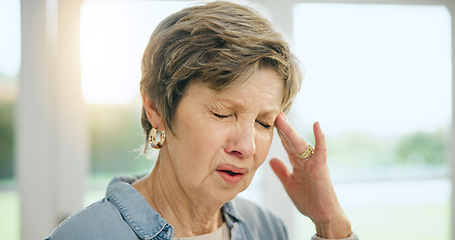 Image showing Frustrated senior woman, headache and stress in burnout, anxiety or depression at home. Closeup of mature female person with migraine, pain or sore head in mental health, mistake or fail at house