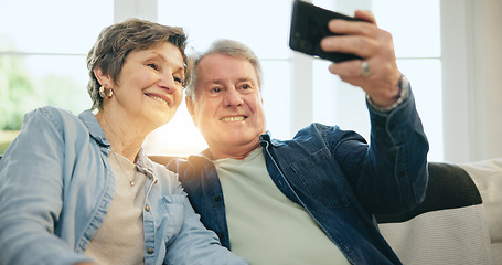 Image showing Happy senior couple, selfie and sofa in living room for photography, memory or picture together at home. Mature man or woman smile in relax for photograph, vlog or social media in retirement at house