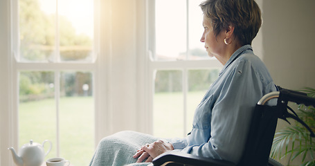 Image showing Wheelchair, senior woman or thinking of memory by window in nursing home or retirement with depression. Grief nostalgia, sad history or lonely mature person in living room to remember past loss