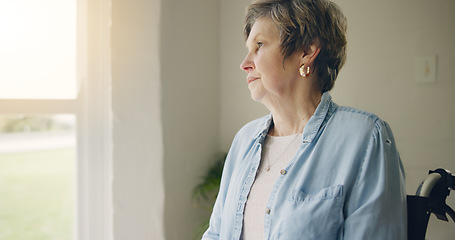 Image showing Wheelchair, elderly woman or thinking of memory by window in nursing home or retirement with depression. Grief nostalgia, sad history or lonely senior person in living room to remember past loss