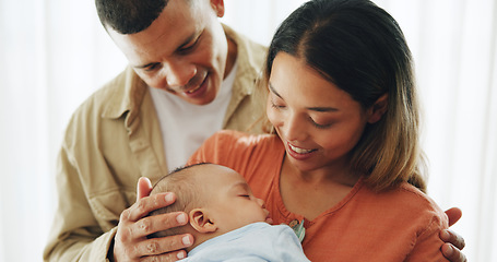 Image showing Family, love and parents with baby happy for bonding, healthy relationship and childcare in home. Smile, childhood and mother, father and newborn infant embrace, care and relax together for happiness