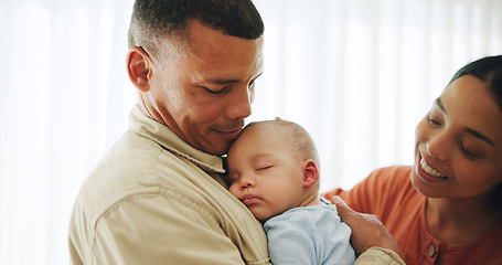 Image showing Family, love and parents holding baby for bonding, healthy relationship and childcare in home. Happy, childhood and mother, father and newborn infant embrace, care and relax together for happiness