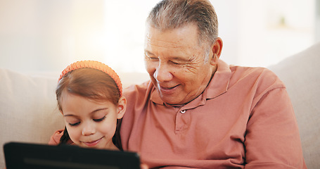 Image showing Home, grandfather on a couch and girl with tablet, happy and relax with social media, internet and digital app. Apartment, old man and pensioner with grandchild, technology and online games with fun