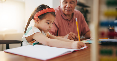 Image showing Grandfather, little girl and writing in book for learning, literature or education together on desk at home. Grandpa, child or kid taking notes in homeschool to read and write on table at house