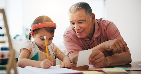 Image showing Child, senior man and education or writing, book and learning at home, drawing and support or paper. Girl, grandfather and notebook or tutoring, assessment and smile for language or math homework