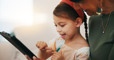 Image showing Home, grandmother and girl with tablet, happy and relax with social media, online gaming and digital app. Apartment, senior woman or pensioner with grandchild, tech or fun with connection or internet