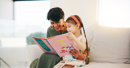 Image showing Happy grandmother, child and reading book on sofa for literature, education or bonding together at home. Grandparent with little girl smile for story, learning or relax on living room couch at house