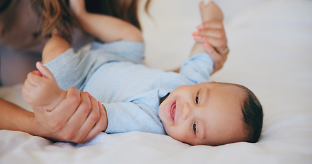 Image showing Hands, love and baby in bed with mother at home, play and bonding together, support or family trust. Child, mom and closeup of infant in bedroom, smile and security, care of toddler and growth of kid