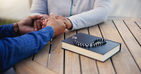 Image showing Bible, praying or couple holding hands on table together in a Christian belief with hope or faith. Jesus, zoom or senior man with woman in prayer to god for spiritual support or worship in religion