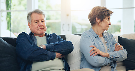 Image showing Senior, couple and stress with divorce and fight on sofa in living room of home with anger and silence. Elderly, man or woman with argument, upset and frustrated on couch in lounge of house or ignore