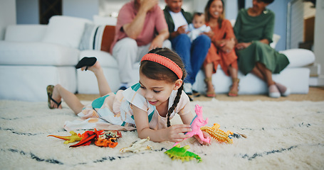 Image showing Girl kid, dinosaur toys and floor with playing, development and relax with game in room at family house. Child, plastic reptile and carpet with hands, flooring or animal for fantasy, learning or home