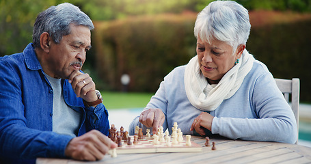 Image showing Senior couple, chess match or thinking of strategy, plan or mindset for brain power or move at home. Elderly woman, old man or board game for problem solving, ideas or challenge to relax in backyard