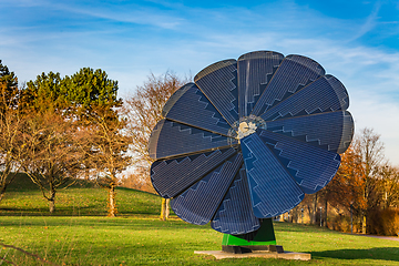 Image showing Rotating solar panel in flower shape in a city park. Photovoltaic, alternative electricity source