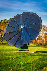 Image showing Rotating solar panel in flower shape in a city park. Photovoltaic, alternative electricity source