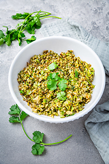 Image showing Roasted organic cauliflower and broccoli rice with herbs - paleo and ketogenic diet concept