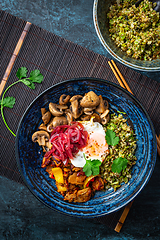 Image showing Ketogenic diet bowl with organic cauliflower and broccoli rice, stir fried chicken, mushrooms, egg and onions