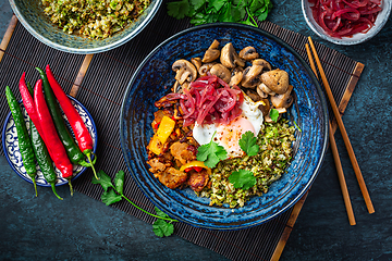 Image showing Ketogenic diet bowl with organic cauliflower and broccoli rice, stir fried chicken, mushrooms, egg and onions