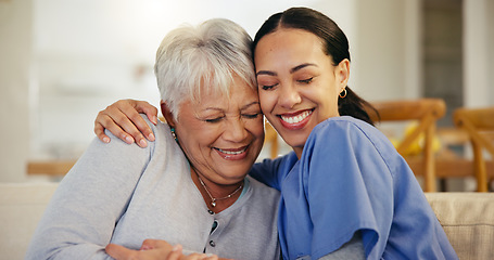 Image showing Happy woman, nurse and hug in elderly care for support, trust or love on living room sofa at old age home. Face of female person, doctor or medical caregiver hugging senior patient in relax at house