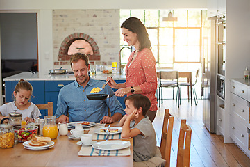 Image showing Breakfast, eggs and morning with a family in the dining room of their home together for health or nutrition. Mom, dad and sibling children eating food at a table in the apartment for love or bonding