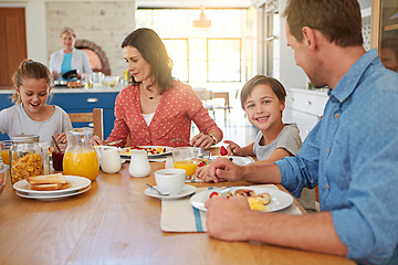 Image showing Food, breakfast and love with a family in the dining room of their home together for nutrition. Portrait of a boy with his parents and sister eating at a table in an apartment for morning bonding