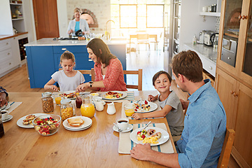 Image showing Food, morning and a family eating breakfast in the dining room of their home together from above. Mother, father and sibling children sitting at a table in their apartment for love or bonding
