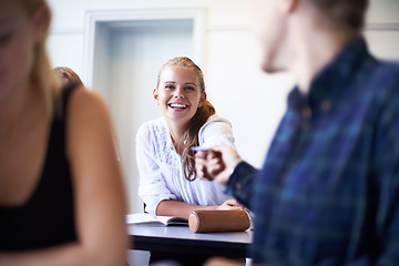 Image showing Student, note and pass a letter in class at high school with friends and social communication. Hand, paper and teenager writing secret, crush and information in classroom with quiet conversation