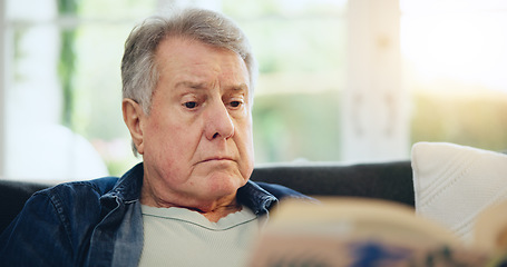 Image showing Face, senior and man for reading in living room with closeup on sofa for peaceful, calmness or relaxing. Elderly person, alone and retirement with book for thinking, information or knowledge in home