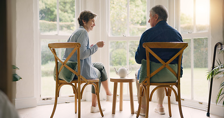 Image showing Back, coffee or old couple talking in home bonding to enjoy a conversation together on break. Listen, communication or senior man in retirement speaking or drinking tea with an elderly woman for love