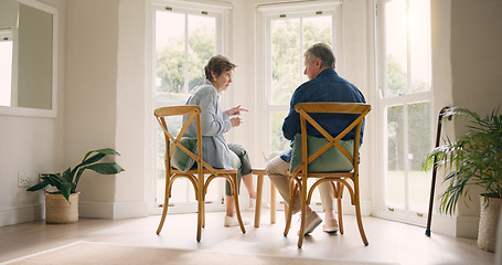Image showing Home, retirement and coffee with senior couple, conversation and discussion with love, bonding together and speaking. Apartment, sunshine and elderly woman with old man, talking and marriage with tea